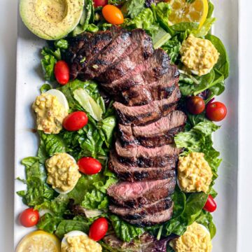 steak salad with deviled eggs and a lemon horseradish truffle dressing by the jam jar kitchen