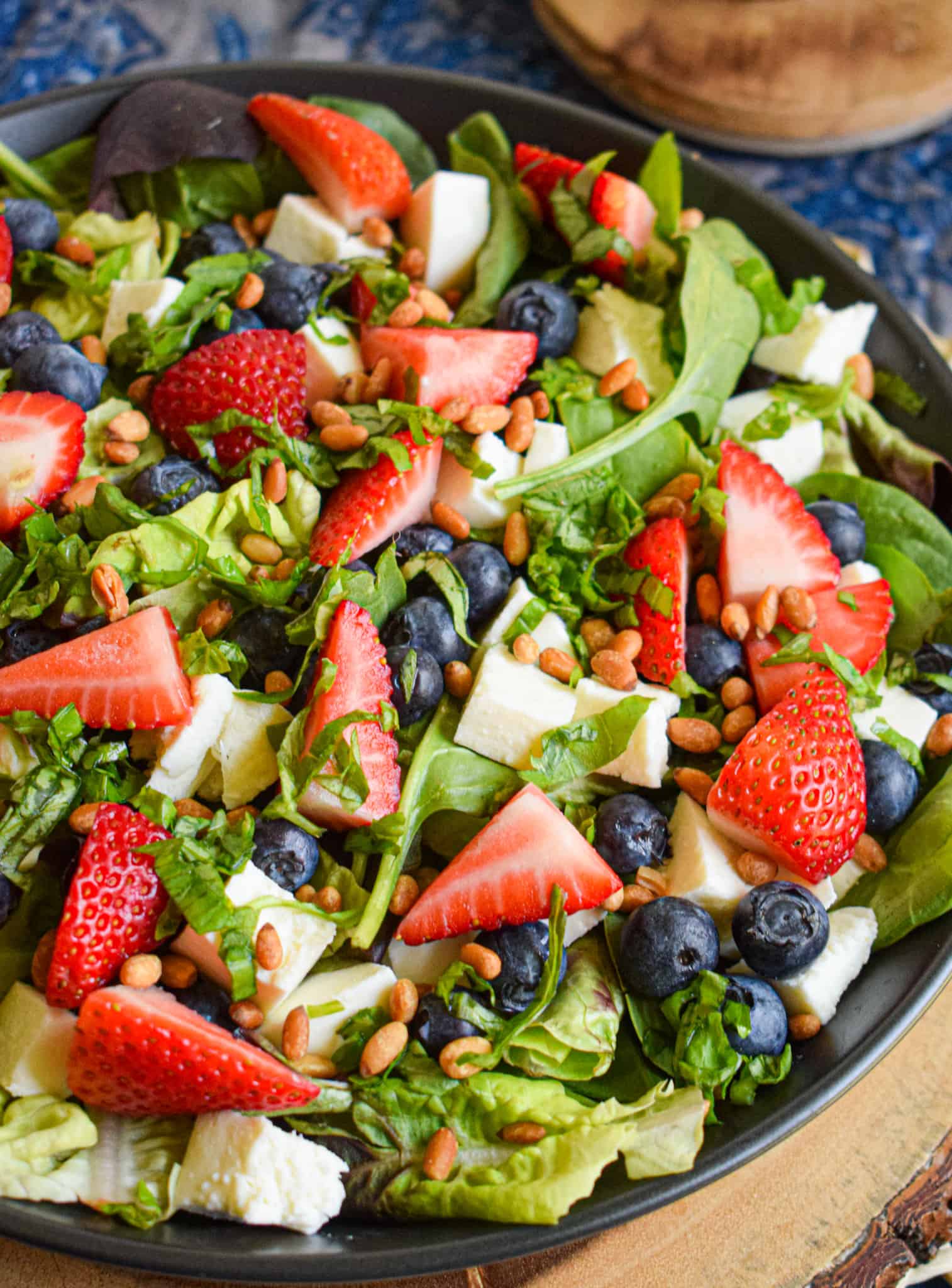 4th of july salad with strawberries, blueberries, mozzarella, pine nuts, basil and balsamic