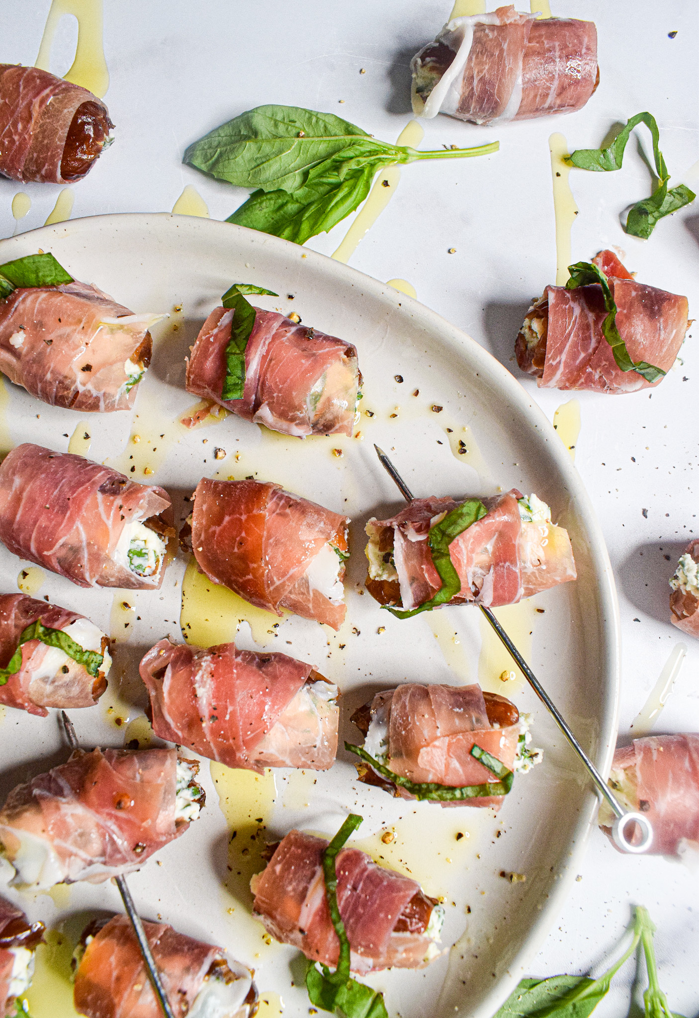 prosciutto wrapped dates stuffed with goat cheese, mascarpone and basil 