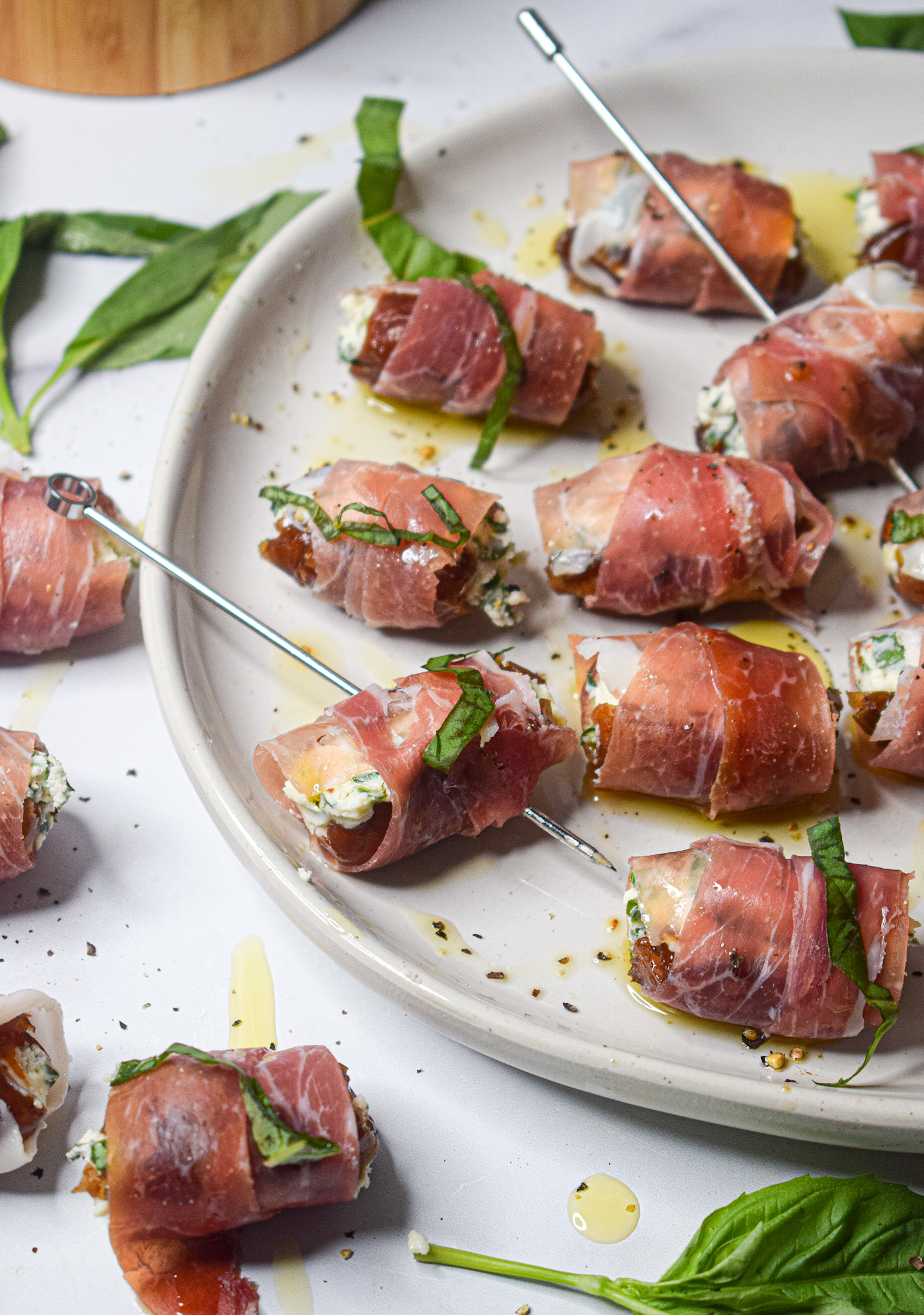easy holiday christmas appetizer recipe prosciutto wrapped dates stuffed with goat cheese and basil