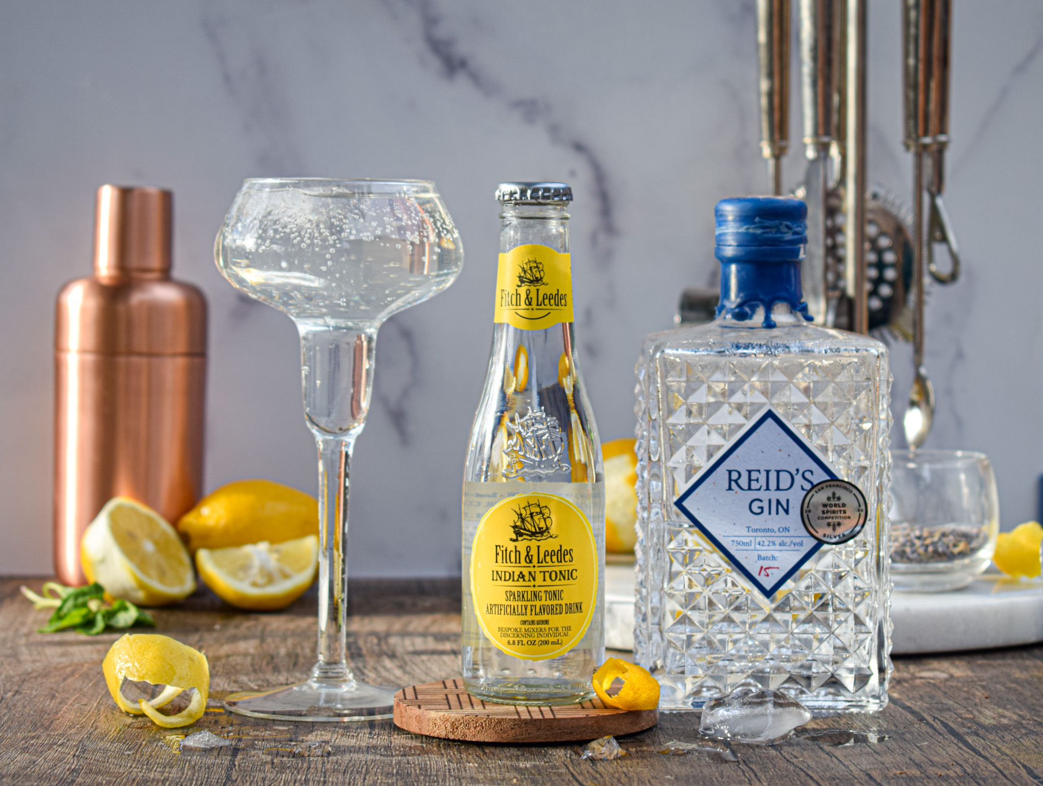bees knees gin and tonic cocktail recipe with honey lemon and lavender
