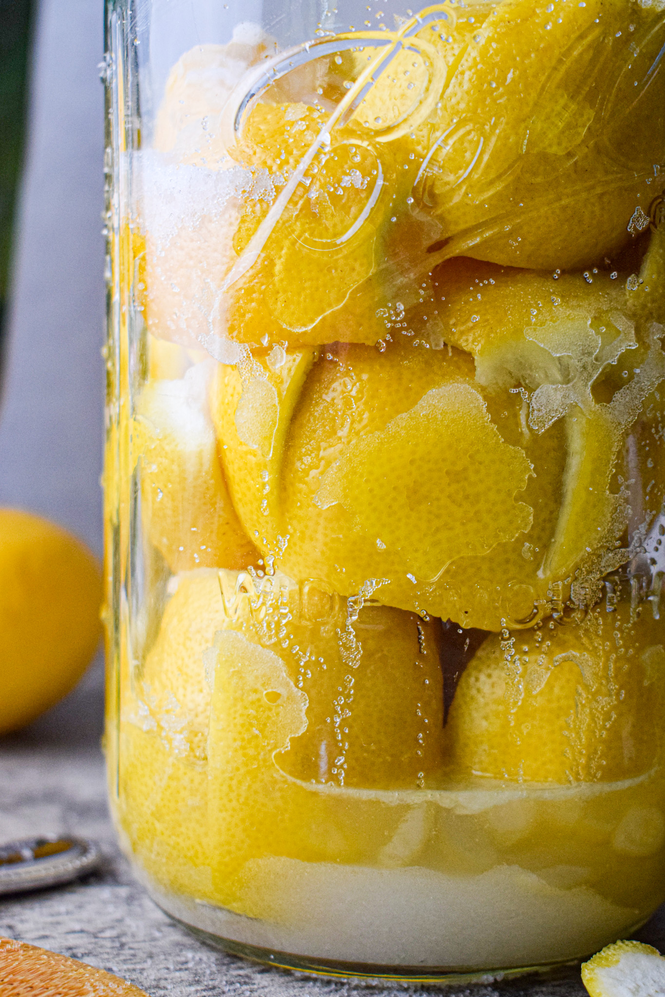 salt preserved lemons pickled fermented in a glass jar 