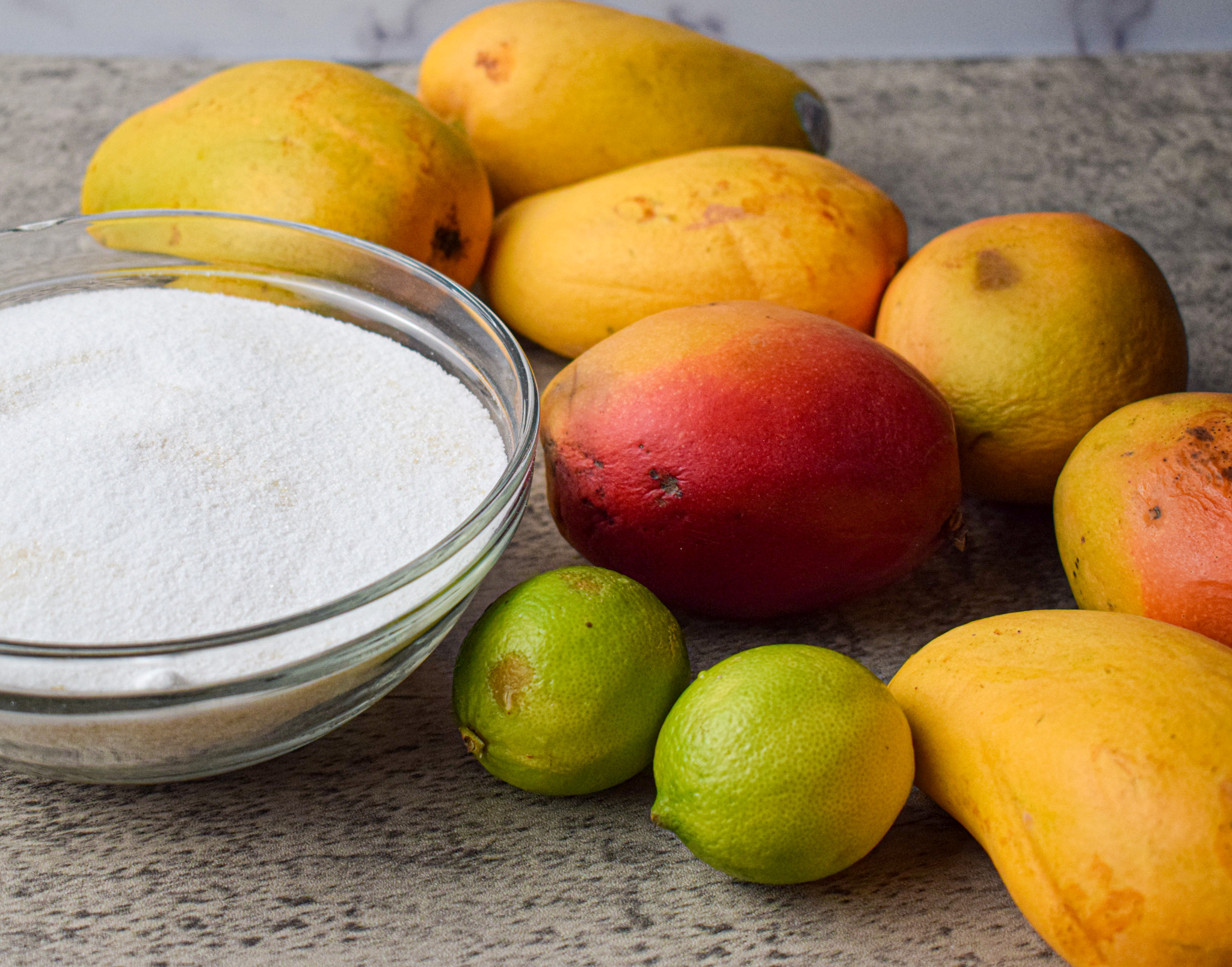 ingredients for easy mango jam recipe, mangos lime and sugar 