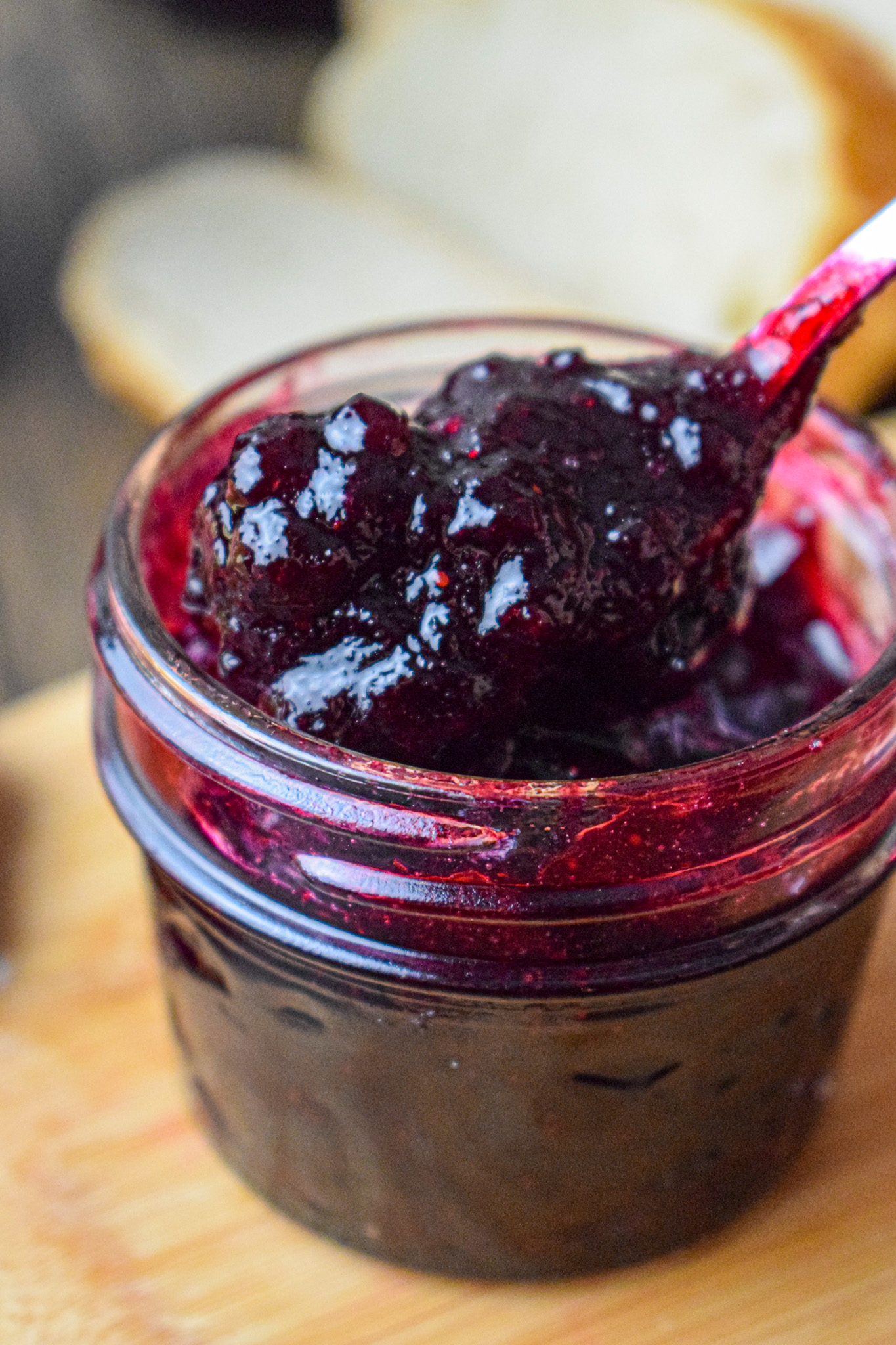 spooning out canned blueberry and rhubarb jam 