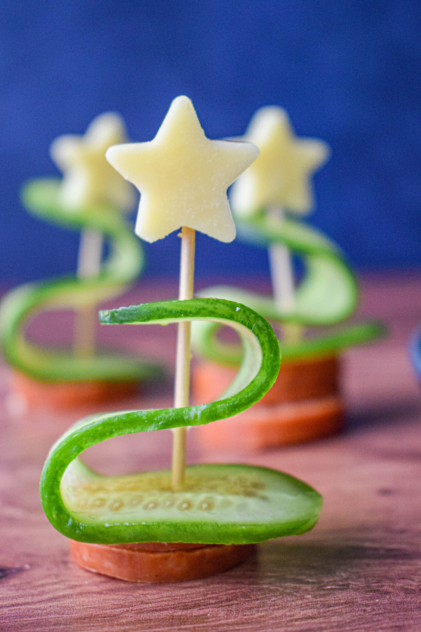 toothpick with white cheddar christmas star, cucumber and pepperoni 