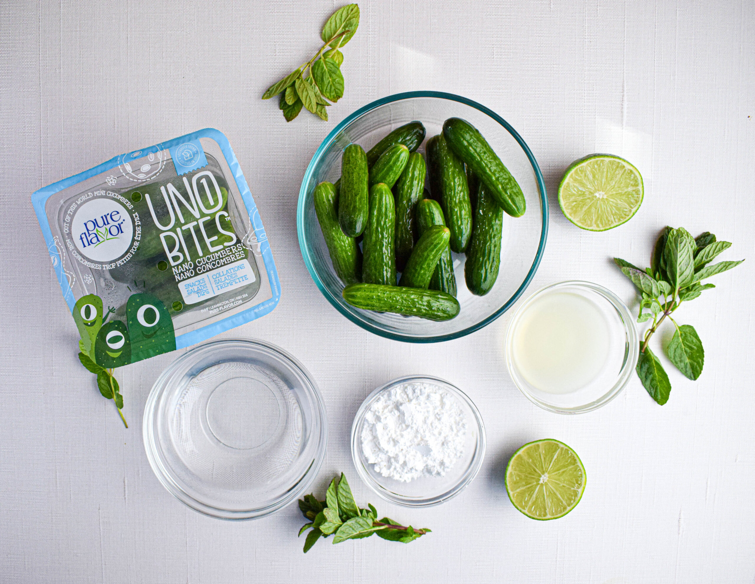ingredients for cucumber granita: mini cucumbers, water, powdered sugar, lime juice, mint leaves 