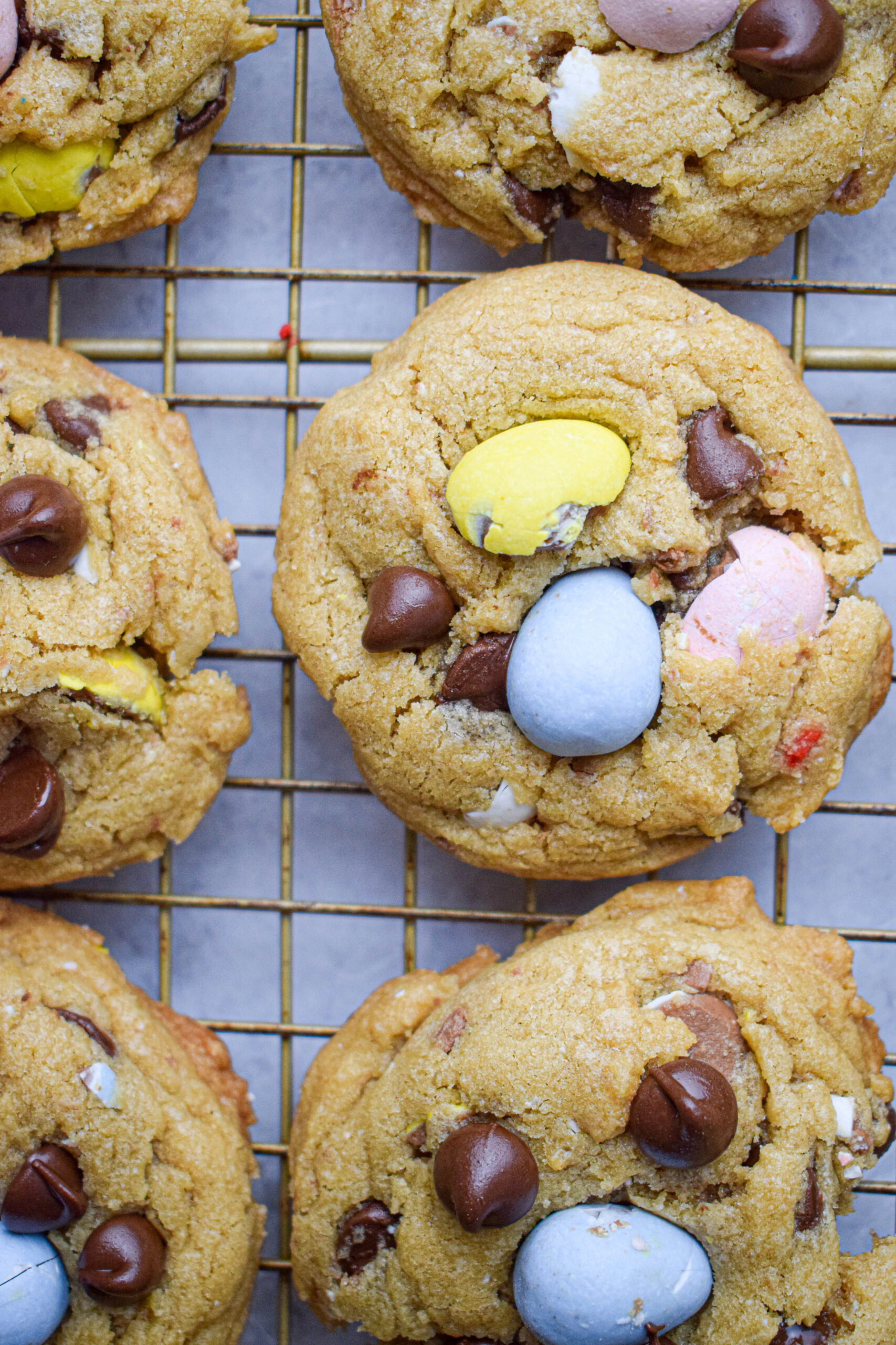 mini egg chocolate chip cookies cooling on a wire rack 