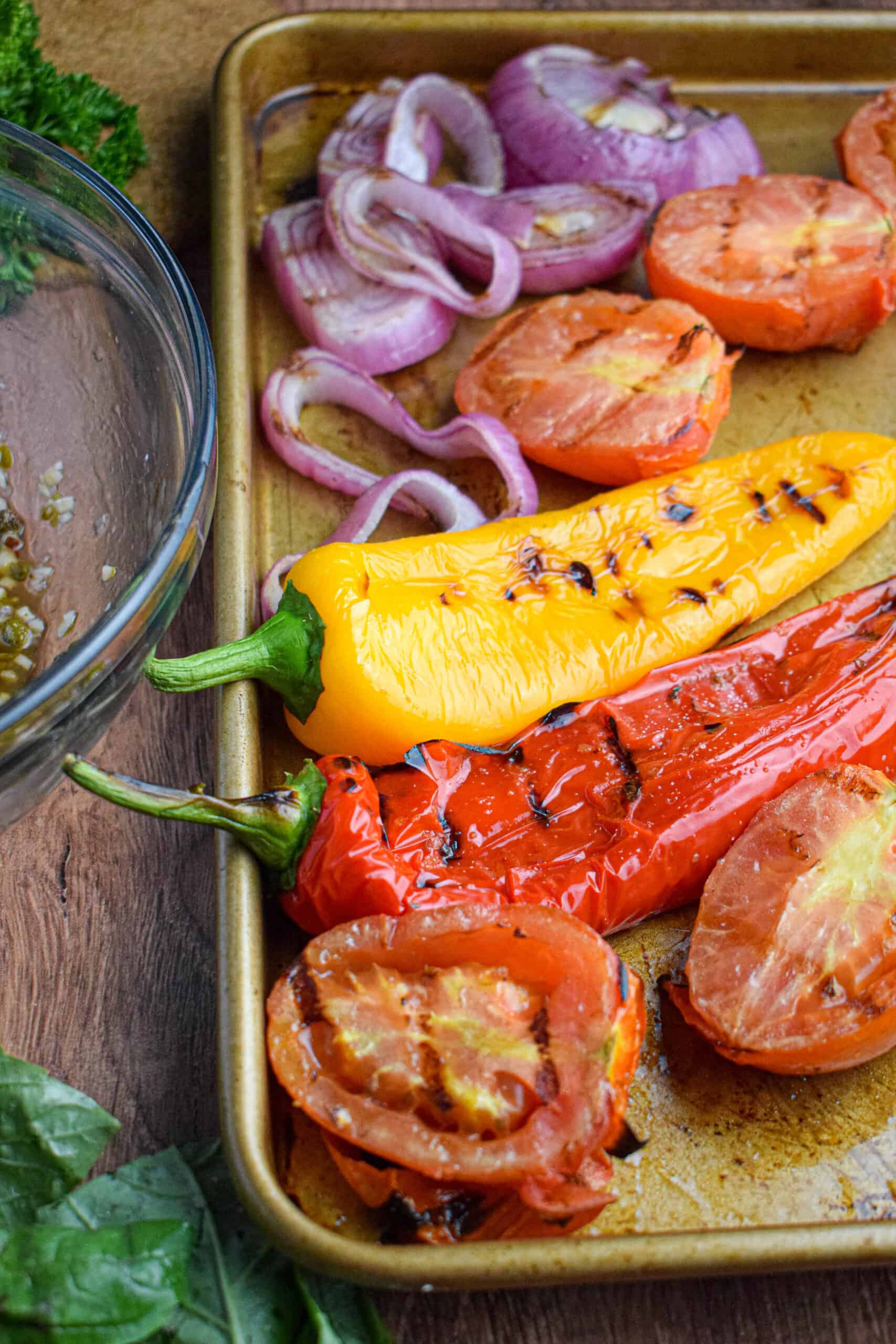 tray of grilled vegetables: peppers, tomatoes and onions