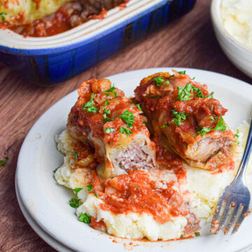 beef stuffed cabbage rolls over mashed potatoes