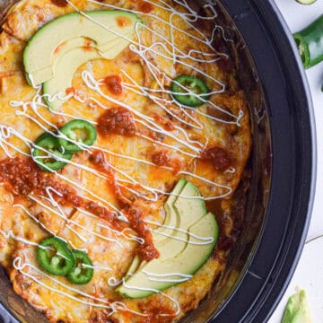 Chicken enchiladas made in the slow cook in casserole form.